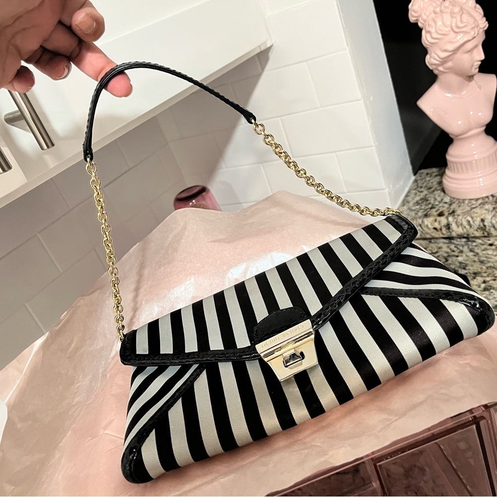 Henri Brendal purse satin with fuchsia inside.